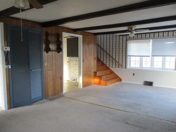 a view of an empty room and closet