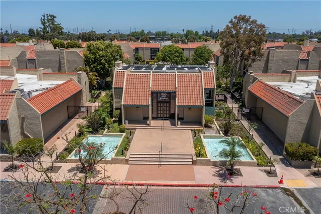 an aerial view of a house with yard swimming pool and outdoor seating