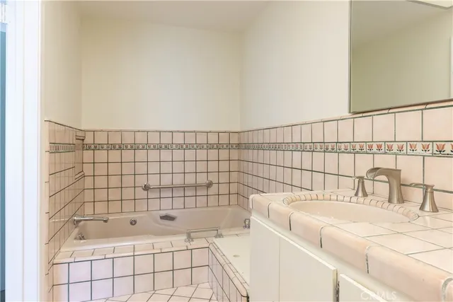 a bathroom with a bathtub and shower