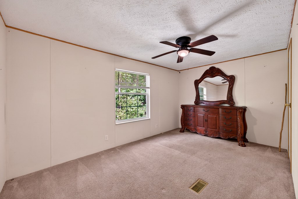 282 West Cherry Road Hayesville, NC 28904 - Photo 16 of 45 a room with furniture and a ceiling fan