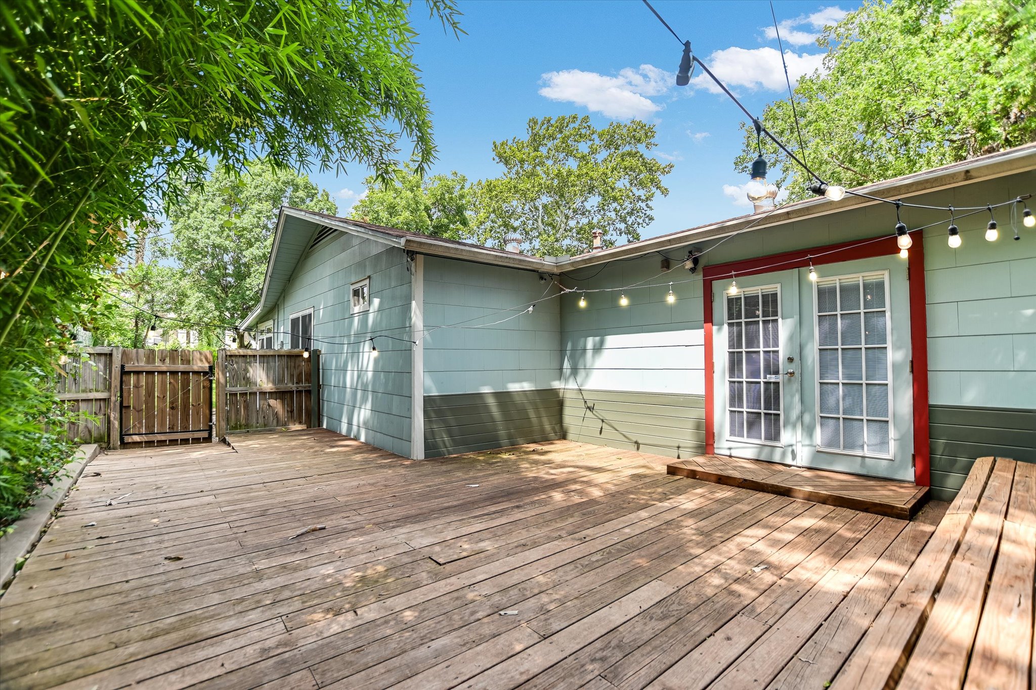 208 Braeswood Road Austin, TX 78704 - Photo 16 of 20 A spacious wooden deck provides an inviting outdoor retreat, ideal for relaxation or entertaining.