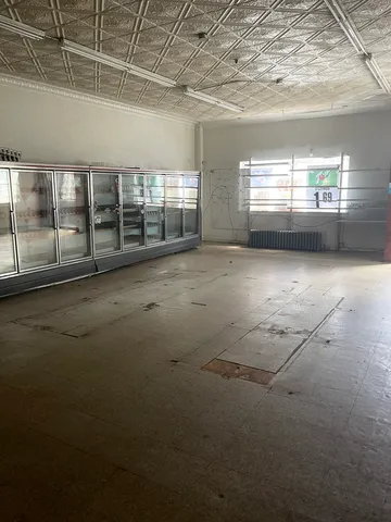 a view of empty room with windows