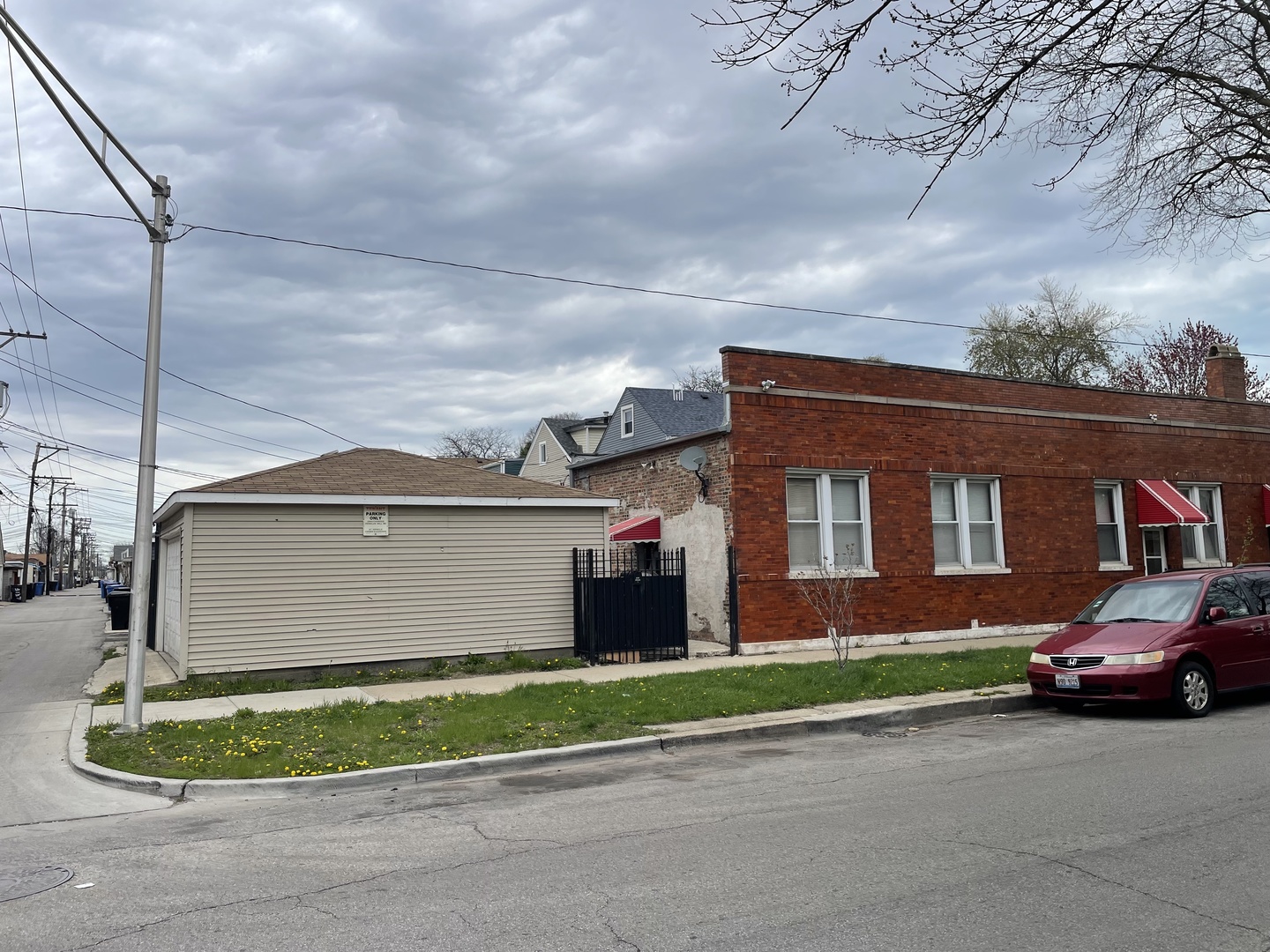 3158 South Harding Avenue Chicago, IL 60623 - Photo 5 of 9 a front view of a house with a yard and garage