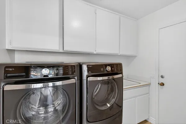 an empty room with floor to ceiling window