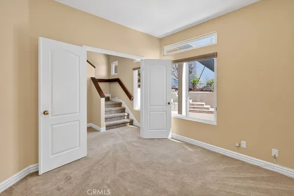 a bathroom with a double vanity sink toilet mirror and shower