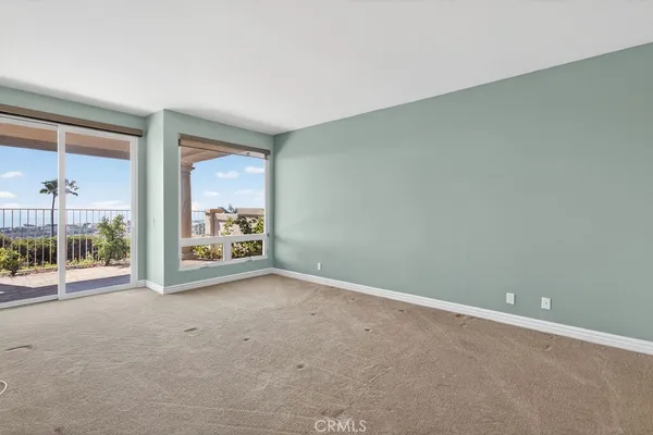 a view of a porch with a floor to ceiling window