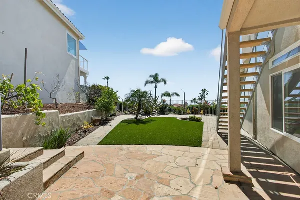 an aerial view of a house with a city view