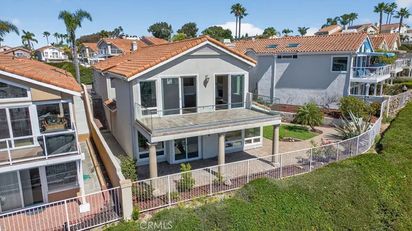 an aerial view of a house with outdoor space and street view