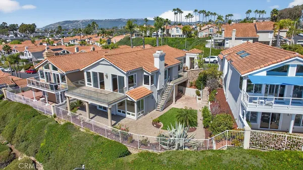 a view of a street with cars parked