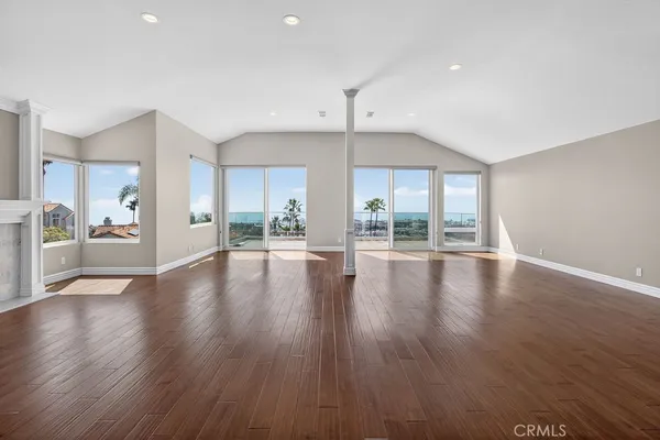 a view of a kitchen with a sink and a refrigerator