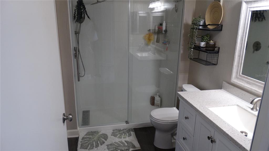 7240 Westpointe Boulevard, Unit 1125 Orlando, FL 32835 - Photo 15 of 33 a bathroom with a sink toilet and shower