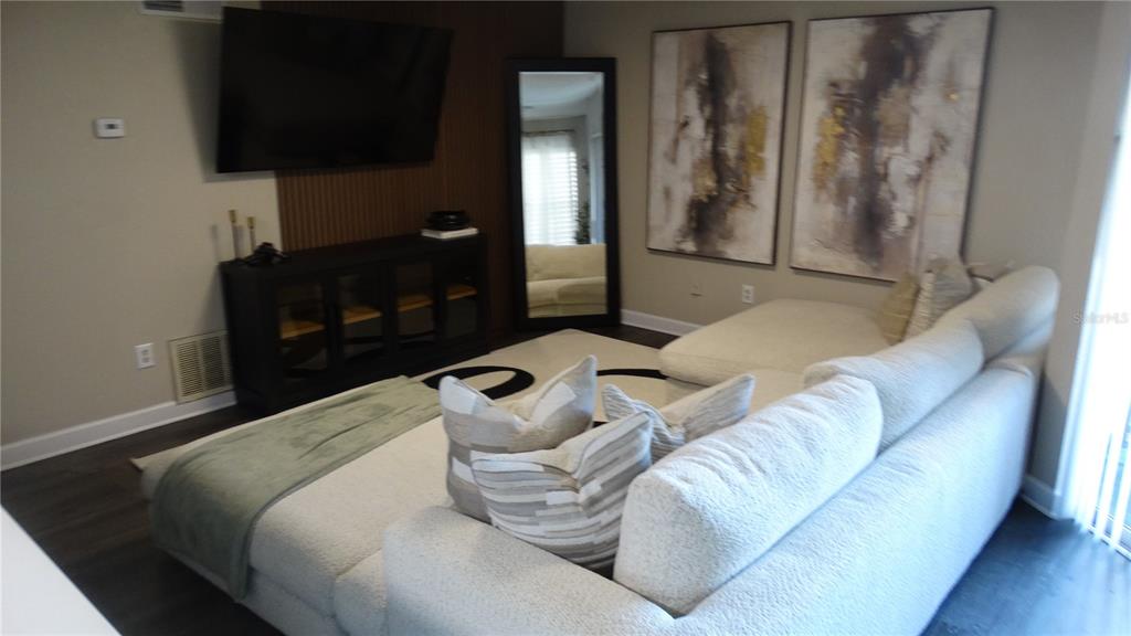 7240 Westpointe Boulevard, Unit 1125 Orlando, FL 32835 - Photo 23 of 33 a living room with furniture