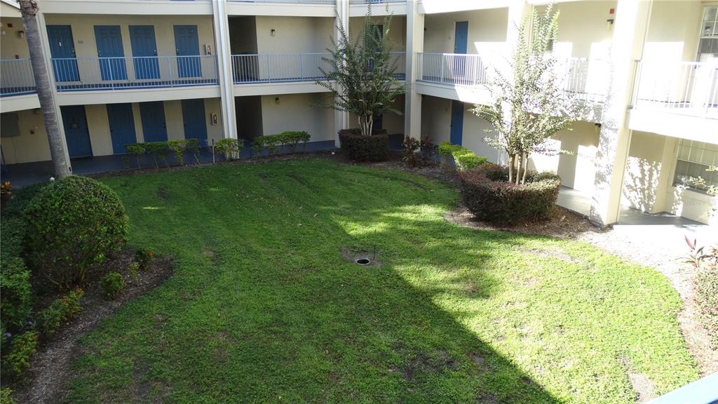 7240 Westpointe Boulevard, Unit 1125 Orlando, FL 32835 - Photo 3 of 33 a view of house with yard