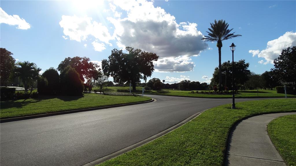 7240 Westpointe Boulevard, Unit 1125 Orlando, FL 32835 - Photo 31 of 33 a view of a golf course with a park