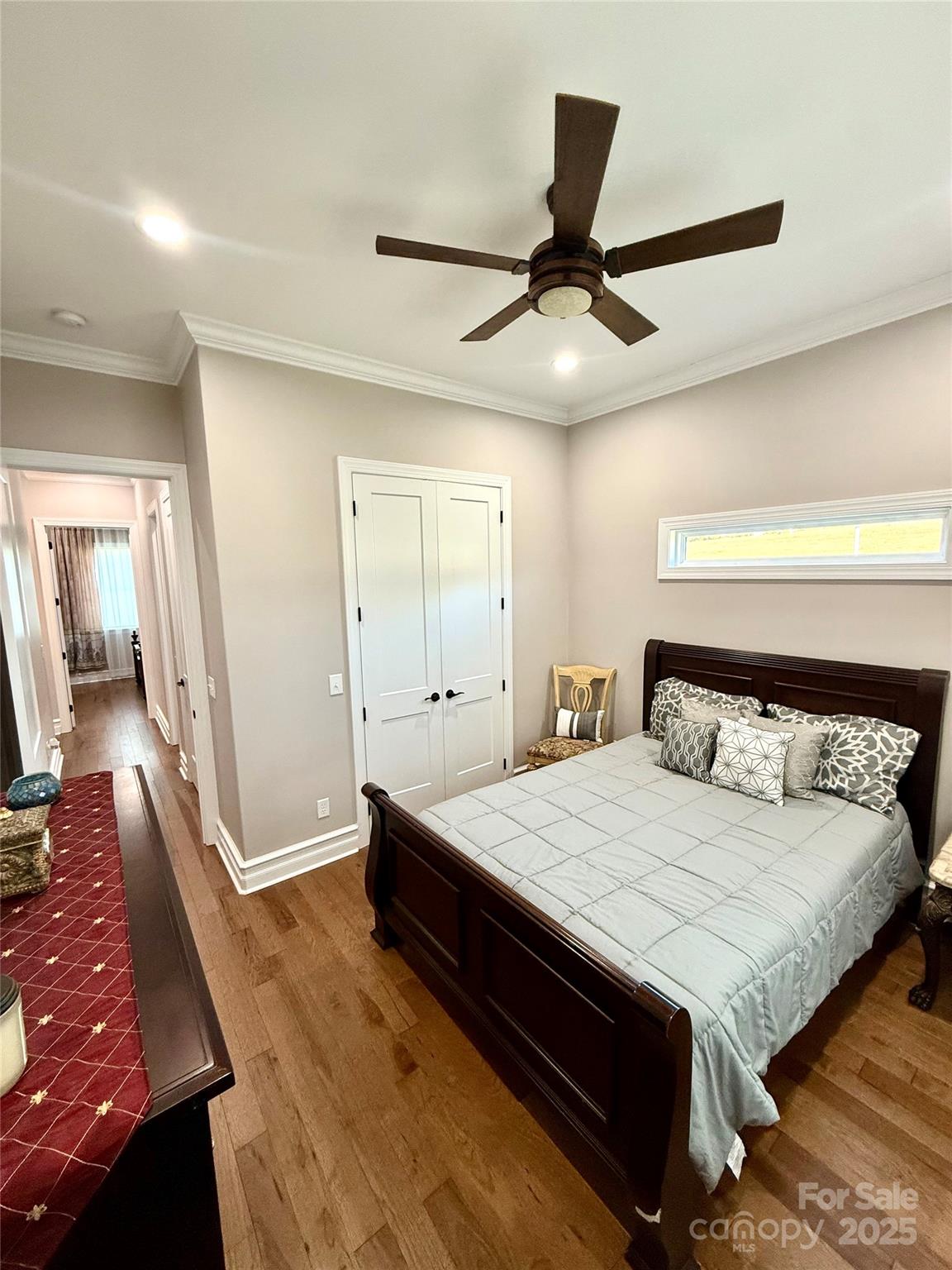 3508 Alfalfa Street Conover, NC 28613 - Photo 17 of 35 a bedroom with a large bed and a chandelier