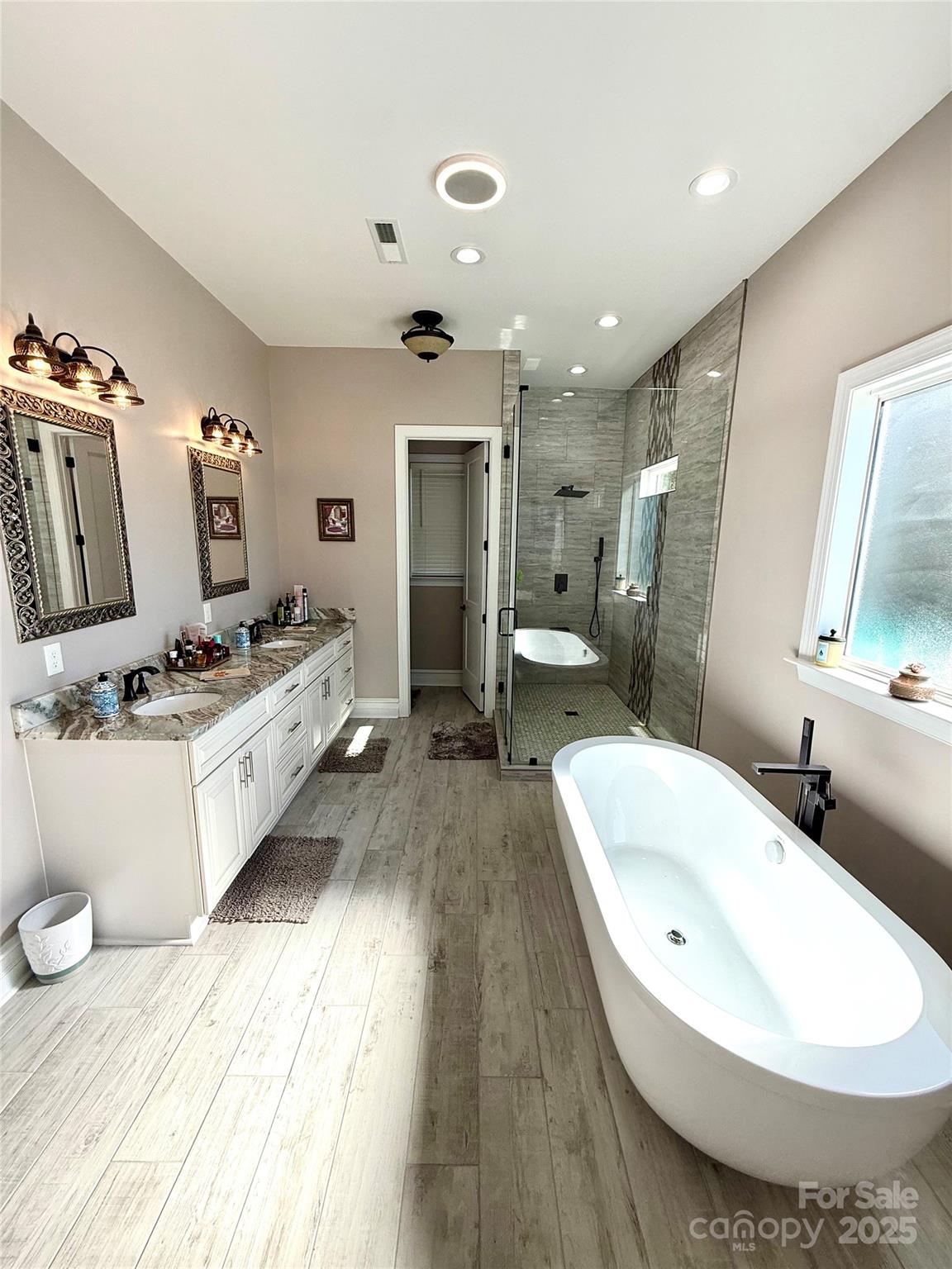 3508 Alfalfa Street Conover, NC 28613 - Photo 27 of 35 a bathroom with a tub sink and mirror