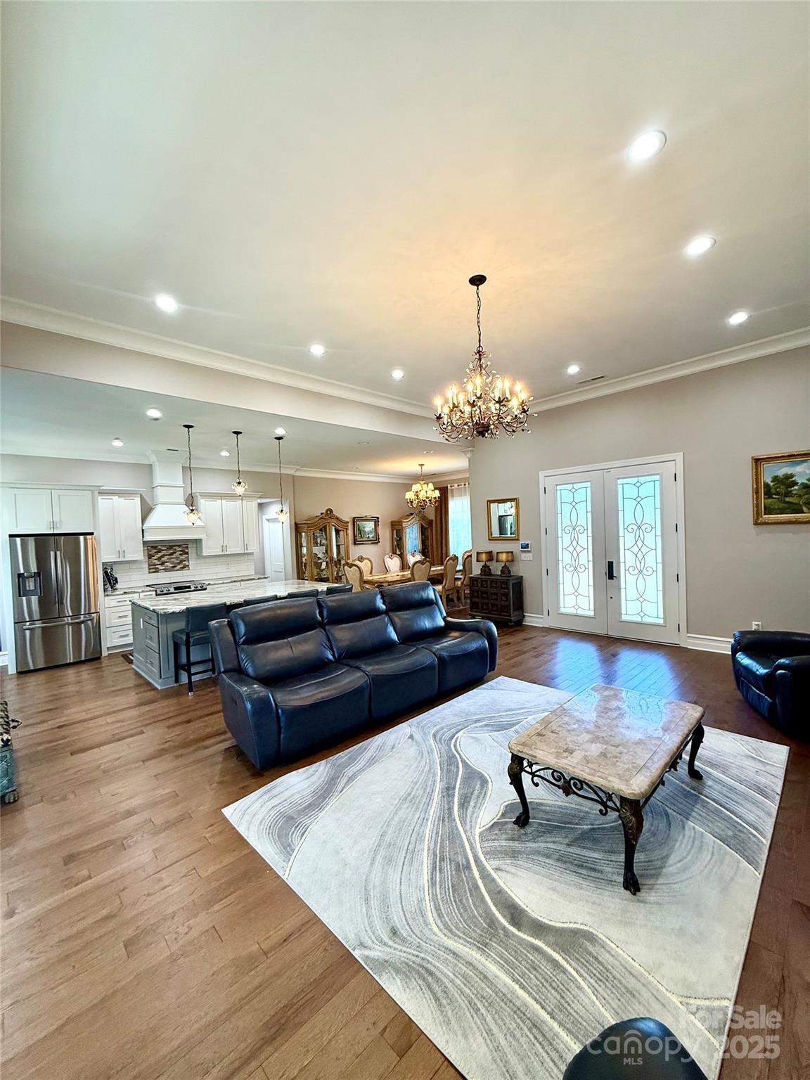 3508 Alfalfa Street Conover, NC 28613 - Photo 10 of 35 a living room with furniture and a chandelier