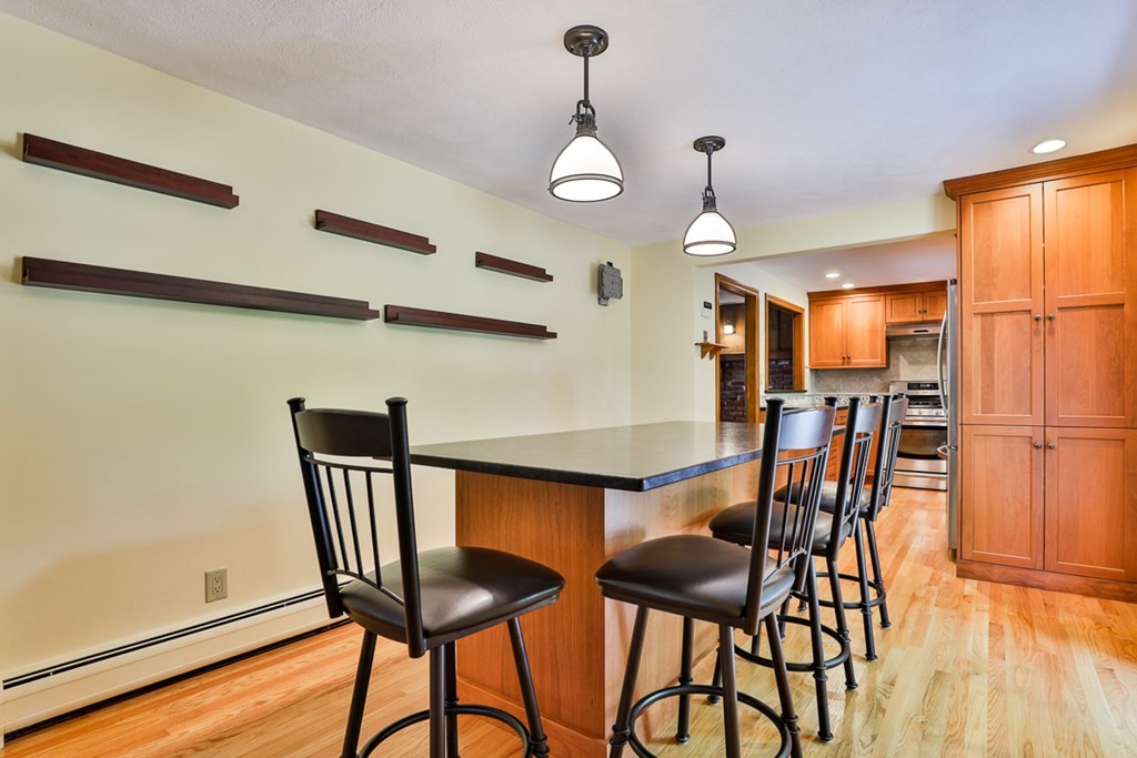 9 Handel Road Billerica, MA 01821 - Photo 15 of 40 a view of a dining room with furniture and wooden floor