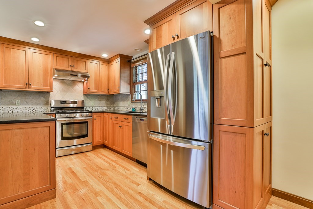 9 Handel Road Billerica, MA 01821 - Photo 18 of 40 a kitchen with granite countertop stainless steel appliances and refrigerator