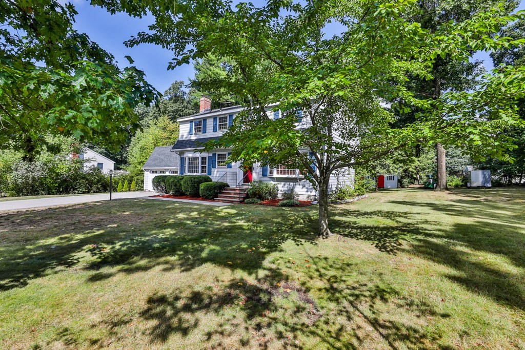 9 Handel Road Billerica, MA 01821 - Photo 3 of 40 a view of a house with a tree in the yard