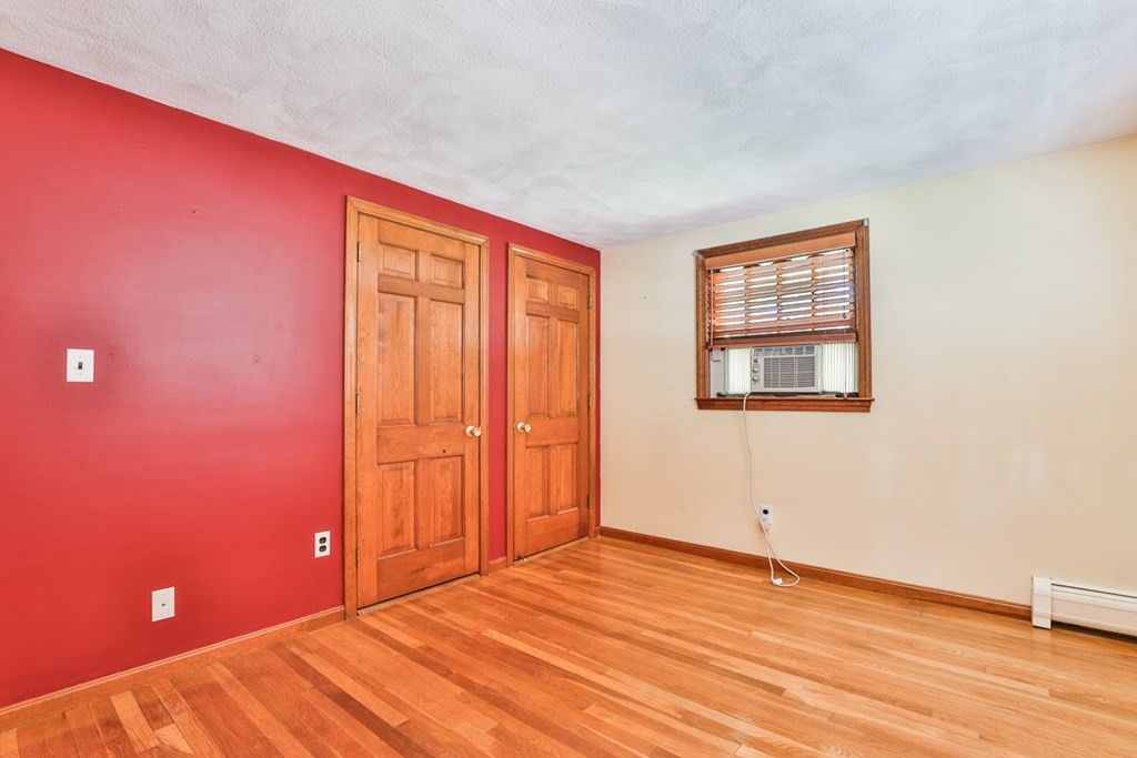 9 Handel Road Billerica, MA 01821 - Photo 38 of 40 a view of an empty room with wooden floor and a window