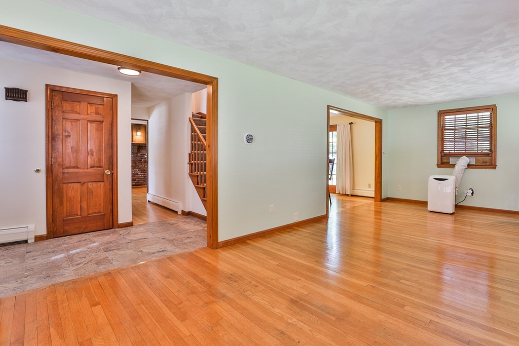 9 Handel Road Billerica, MA 01821 - Photo 10 of 40 a view of empty room with wooden floor and fan
