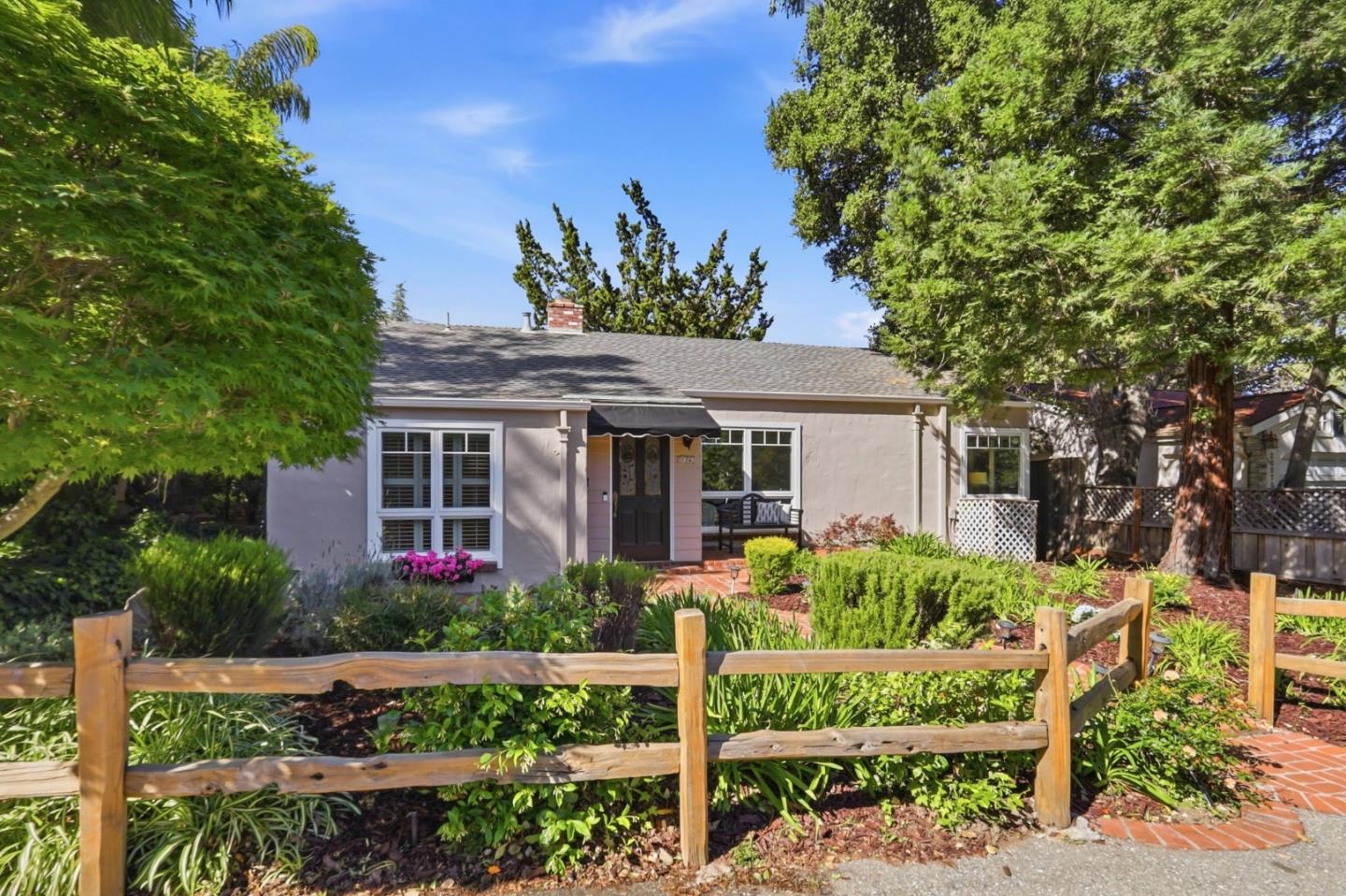 20360 Orchard Road Saratoga, CA 95070 - Photo 1 of 43 a front view of a house with a yard