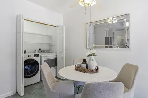 a living room with furniture and a rug