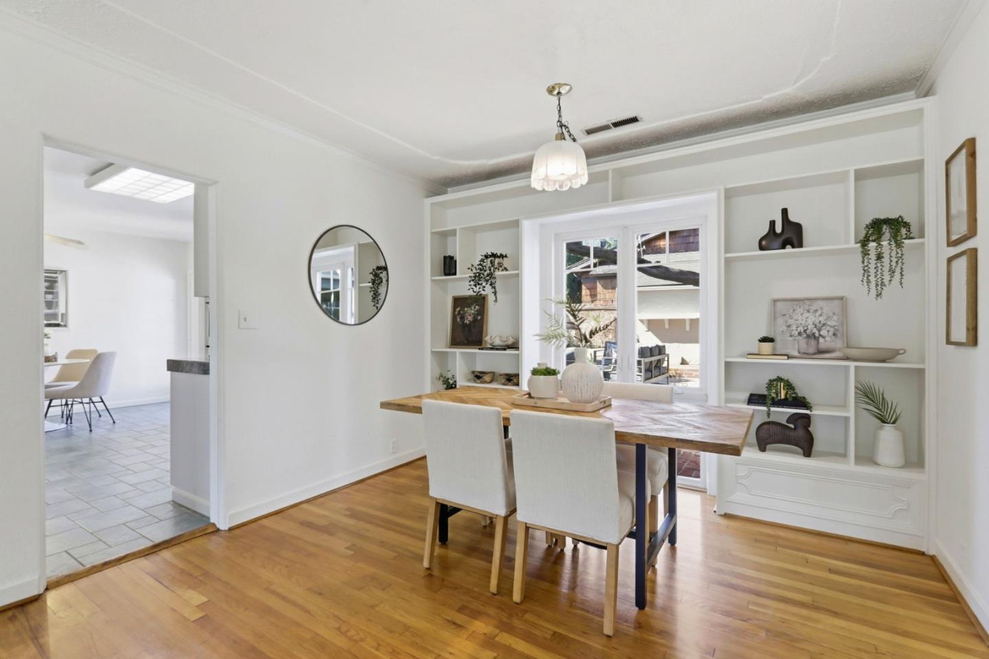 20360 Orchard Road Saratoga, CA 95070 - Photo 19 of 43 a view of a dining room with furniture and wooden floor