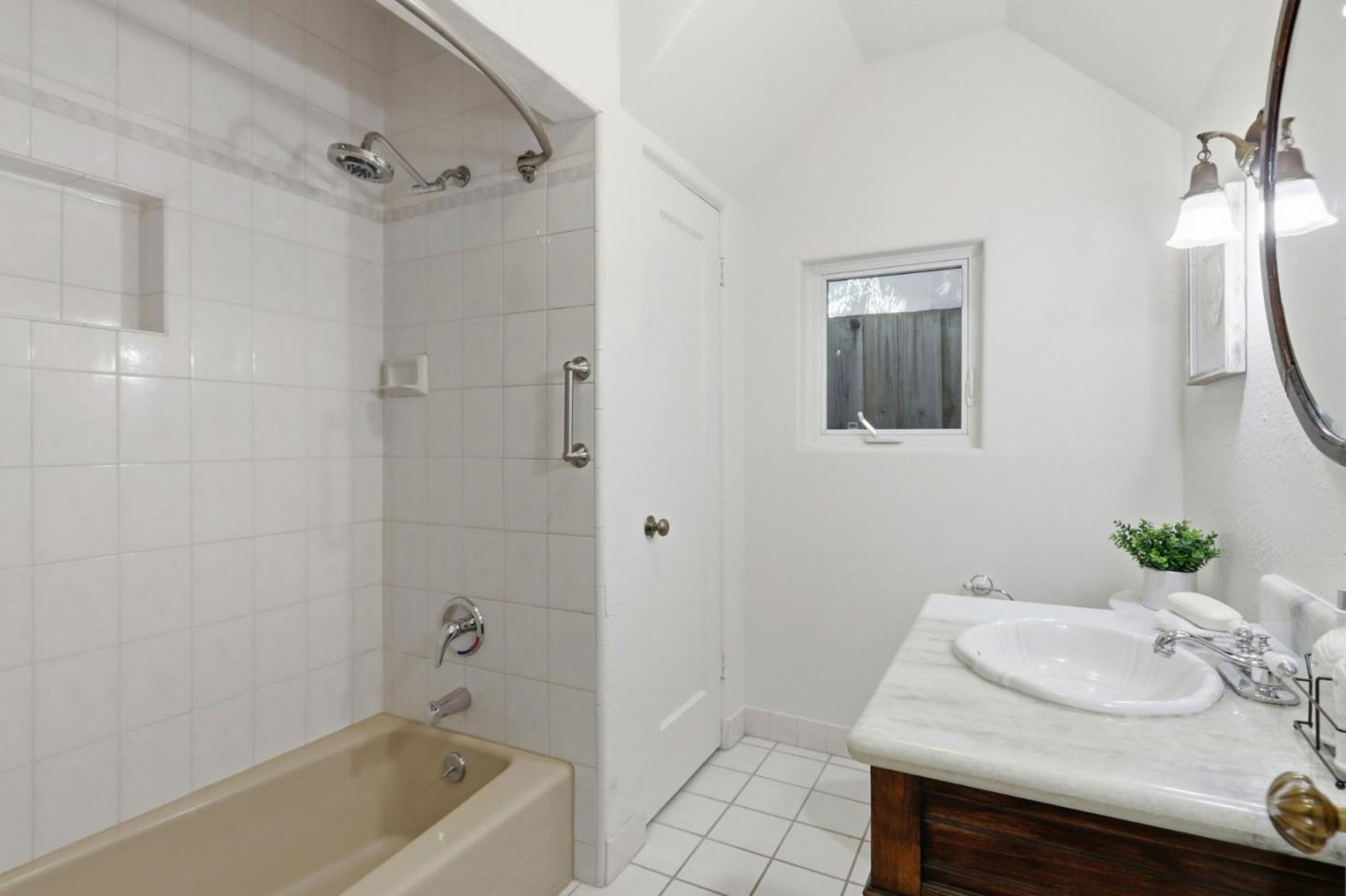 20360 Orchard Road Saratoga, CA 95070 - Photo 29 of 43 a bathroom with a tub sink and mirror