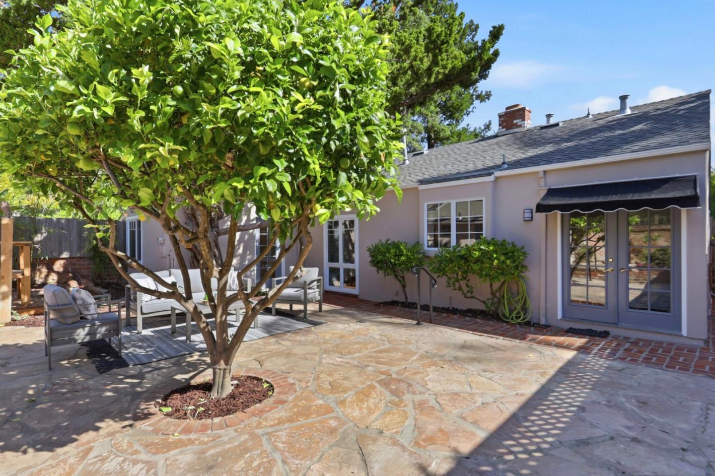 20360 Orchard Road Saratoga, CA 95070 - Photo 32 of 43 a view of a house with a small yard plants and large tree