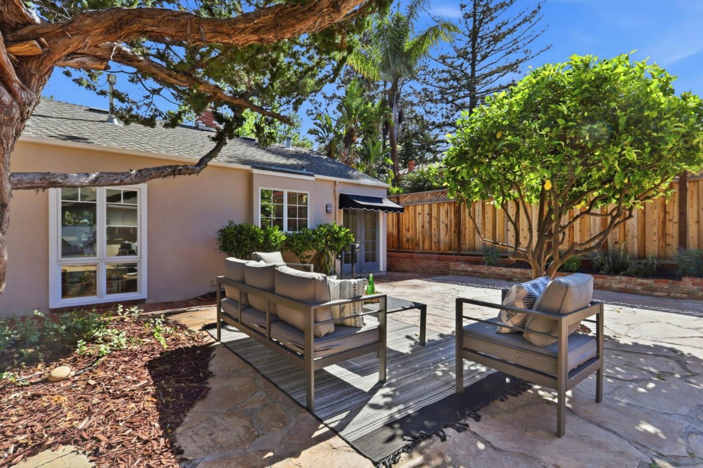 20360 Orchard Road Saratoga, CA 95070 - Photo 36 of 43 a house view with a sitting space garden and outdoor seating