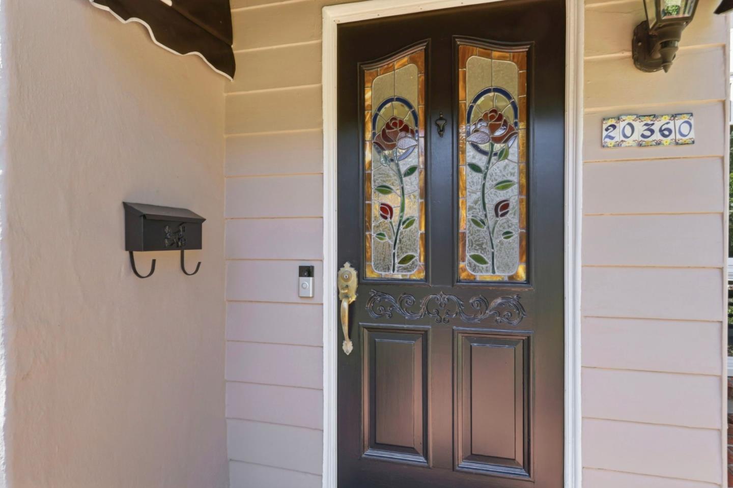 20360 Orchard Road Saratoga, CA 95070 - Photo 5 of 43 a front view of a house with front door