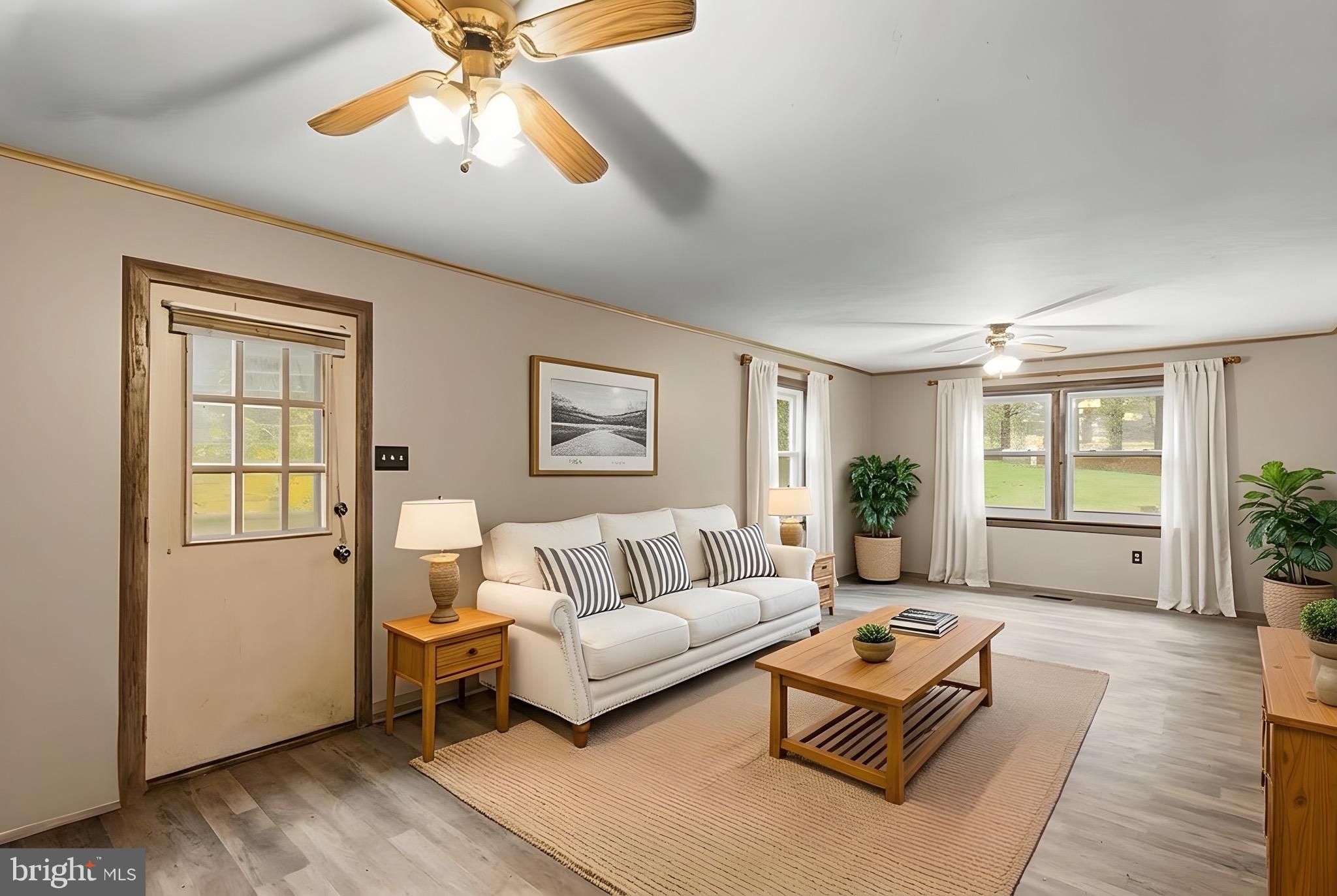 909 Emory Church Road Upperco, MD 21155 - Photo 13 of 34 a living room with furniture and a window