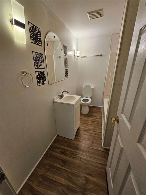 1252 Lawrenceville-Suwanee Road Lawrenceville, GA 30043 - Photo 15 of 64 a bathroom with a toilet sink and mirror