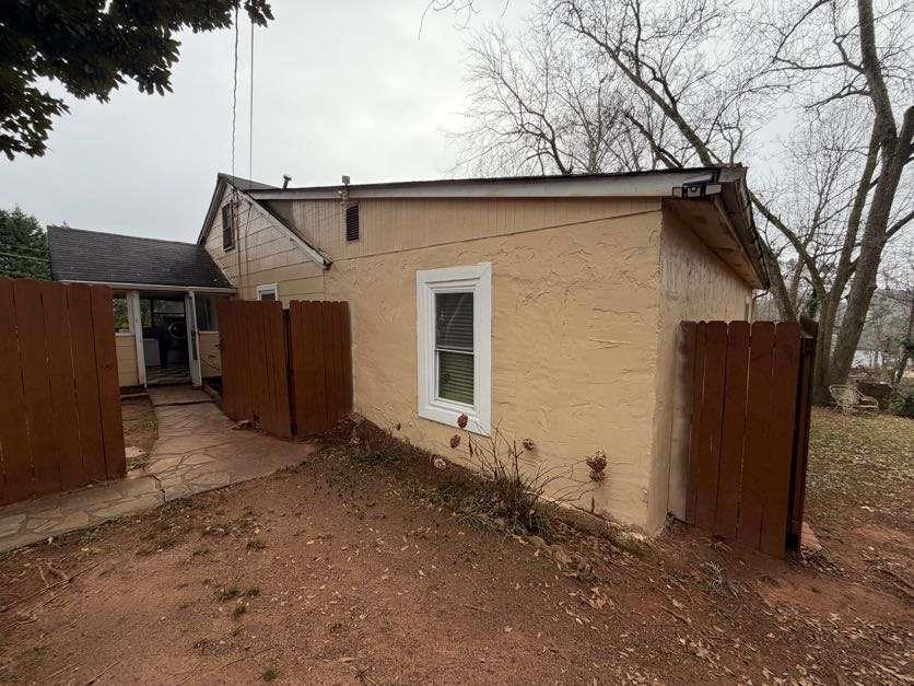 1252 Lawrenceville-Suwanee Road Lawrenceville, GA 30043 - Photo 27 of 64 a backyard of a house with lots of green space