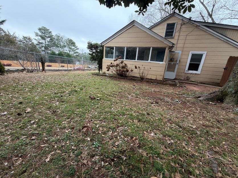 1252 Lawrenceville-Suwanee Road Lawrenceville, GA 30043 - Photo 31 of 64 a front view of a house with garden