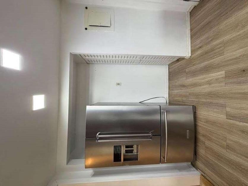 1252 Lawrenceville-Suwanee Road Lawrenceville, GA 30043 - Photo 33 of 64 a view of a kitchen with wooden floor and a kitchen space