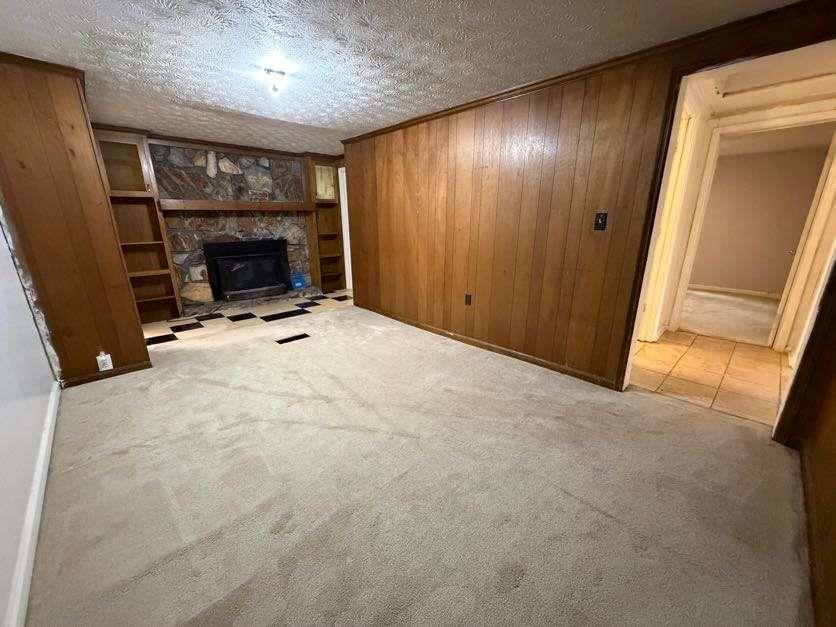 1252 Lawrenceville-Suwanee Road Lawrenceville, GA 30043 - Photo 43 of 64 a view of an empty room with wooden floor and a fireplace