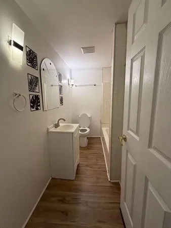 a view of a backyard with large trees