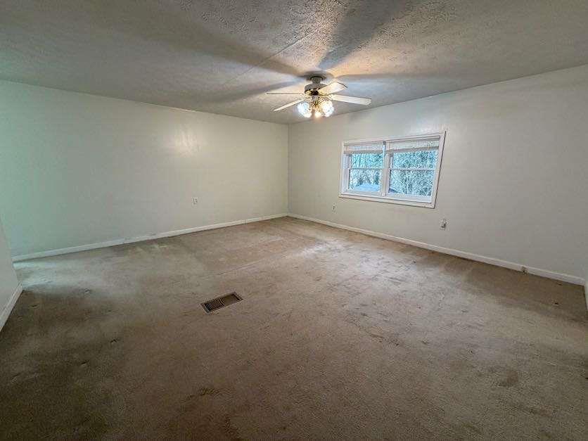 1252 Lawrenceville-Suwanee Road Lawrenceville, GA 30043 - Photo 49 of 64 an empty room with a fan & a window
