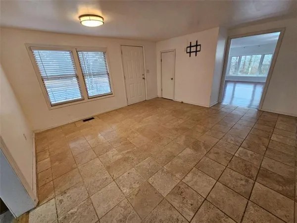 an empty room with windows
