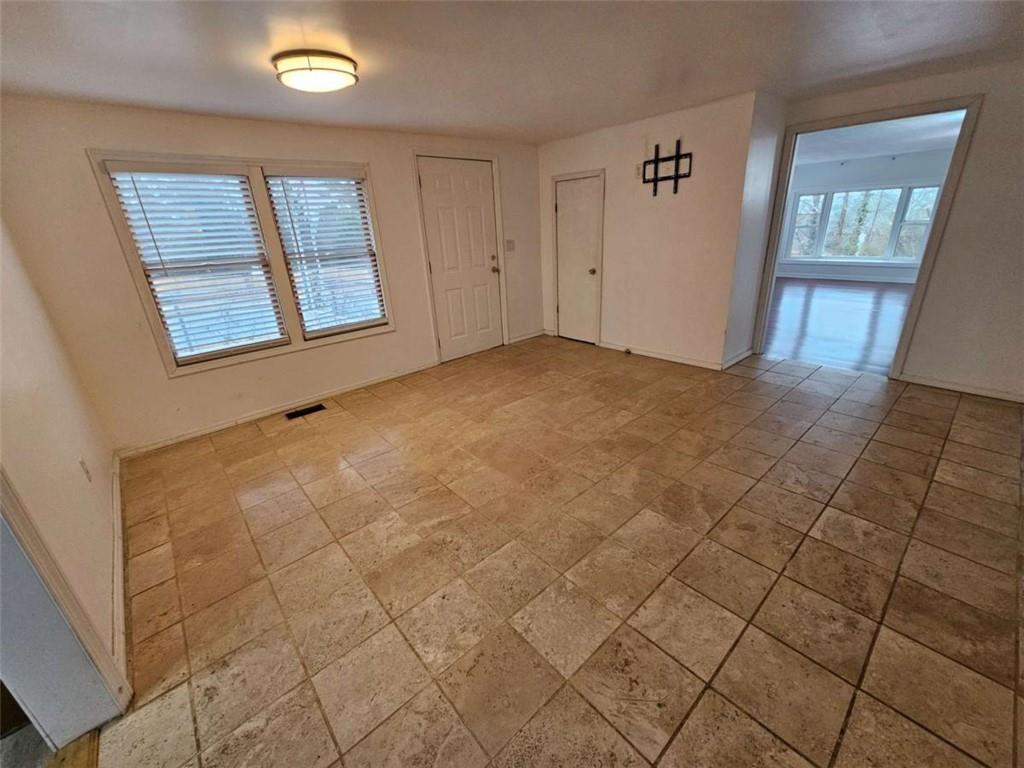 1252 Lawrenceville-Suwanee Road Lawrenceville, GA 30043 - Photo 5 of 64 an empty room with windows
