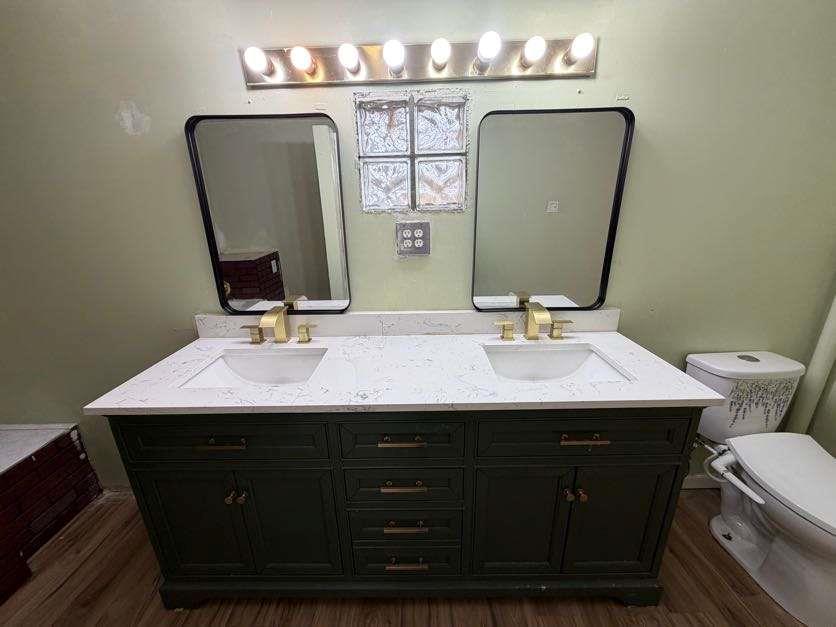 1252 Lawrenceville-Suwanee Road Lawrenceville, GA 30043 - Photo 55 of 64 a bathroom with a sink vanity and a mirror