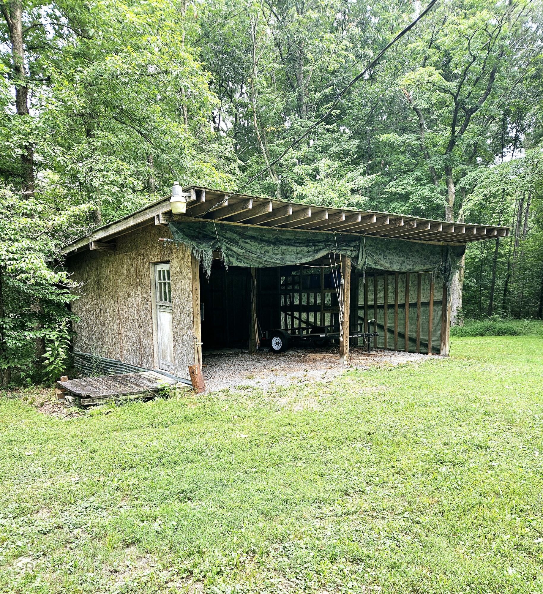 1262 Johnson Road Southeast Cleveland, TN 37323 - Photo 33 of 34 a front view of a house with a garden