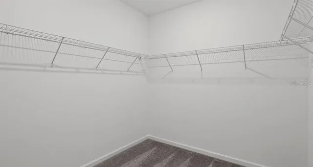 a bathroom with a shower sink and mirror