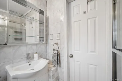 a bathroom with a bathtub and shower