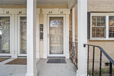 a front view of a house with a glass door
