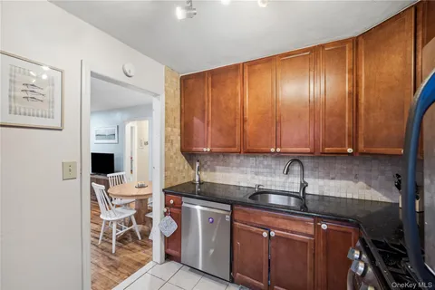 a kitchen with a sink cabinets and window