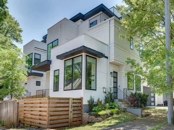 front view of a house with a small yard